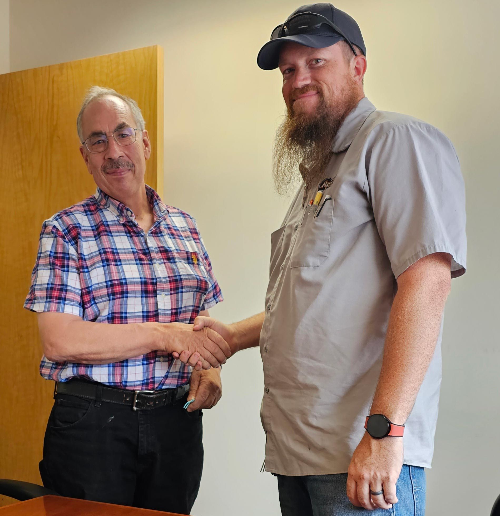 Two Men Shaking Hands — Loveland, CO — Pop-A-Lock Of Northern Colorado Two Men Shaking Hands — Loveland, CO — Pop-A-Lock Of Northern Colorado